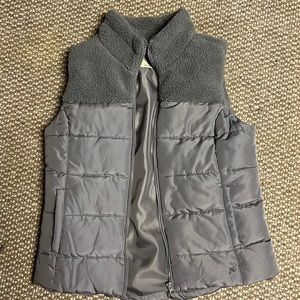 This is Ruff Hewn vest, grey with fluff on top half